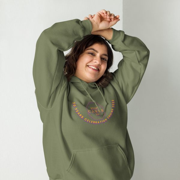 A woman in a green hoodie is stretching her arms.