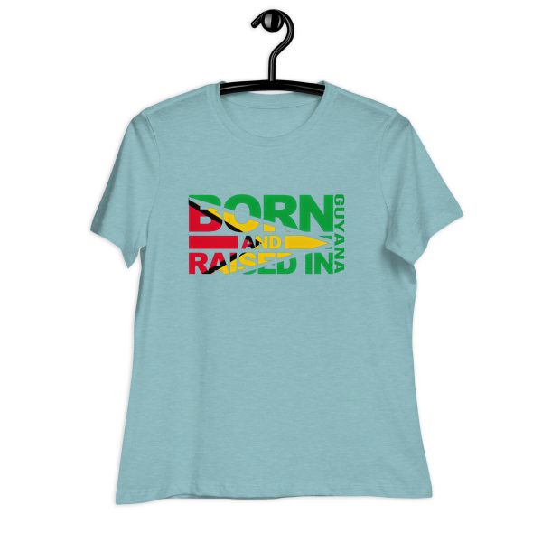 A light blue t-shirt with the words born and raised in jamaica.