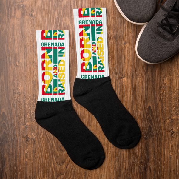 A pair of socks with the words born and raised in brazil on them.