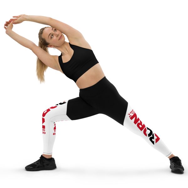 A woman in black and white leggings doing yoga.