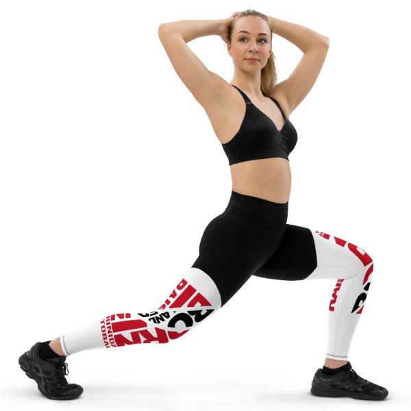 A woman in black and white leggings doing yoga.