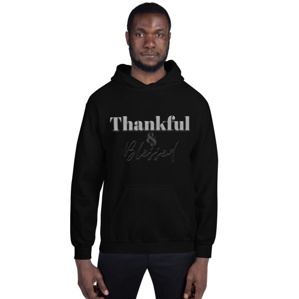 A man wearing a black hoodie with the words thankful and blessed written on it.