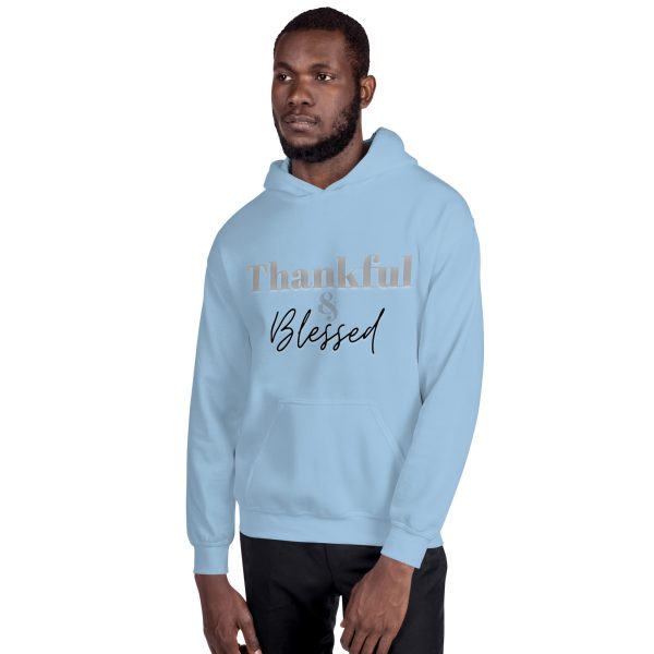 A man in light blue hoodie with the words " blessed " written on it.