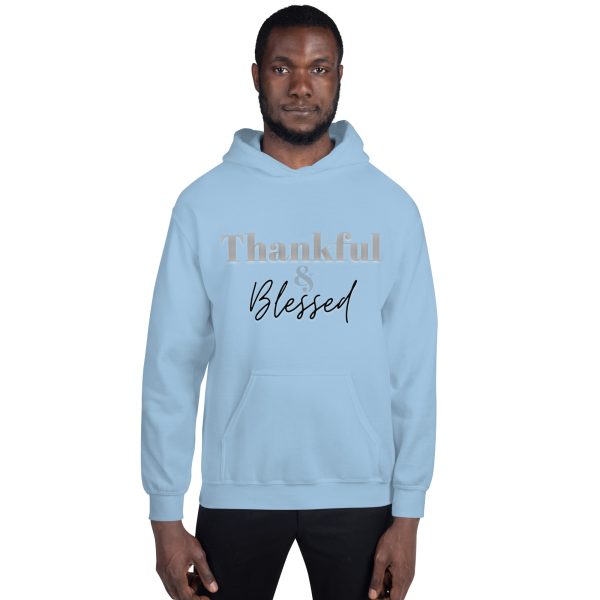 A man in light blue hoodie with the words thankful blessed written on it.