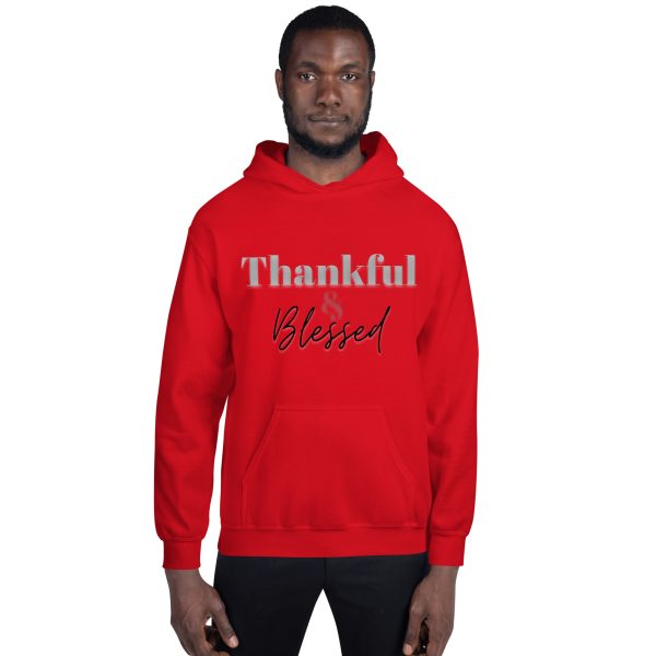 A man wearing a red hoodie with the words " thankful and blessed ".