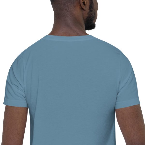 A man wearing a blue shirt with his back turned to the camera.