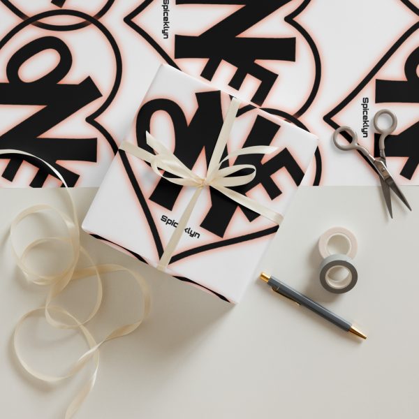 A table topped with scissors and some wrapping paper.