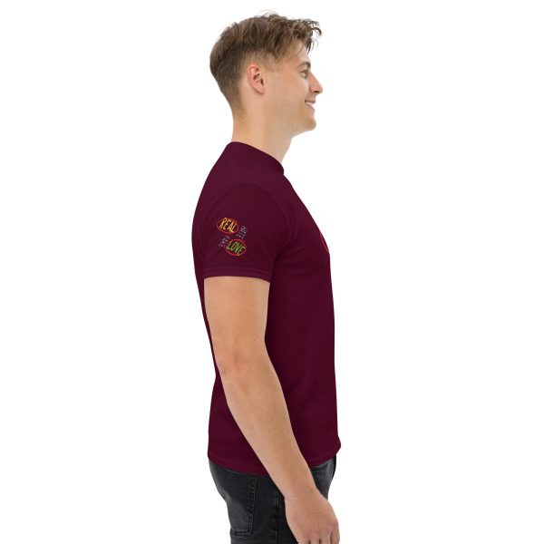 A man wearing a maroon t-shirt with the logo of the company.