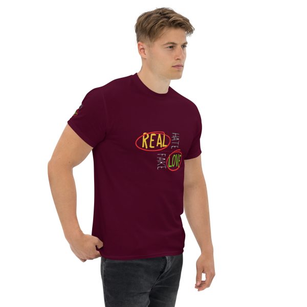 A man wearing a maroon t-shirt with the words " real is fun ".